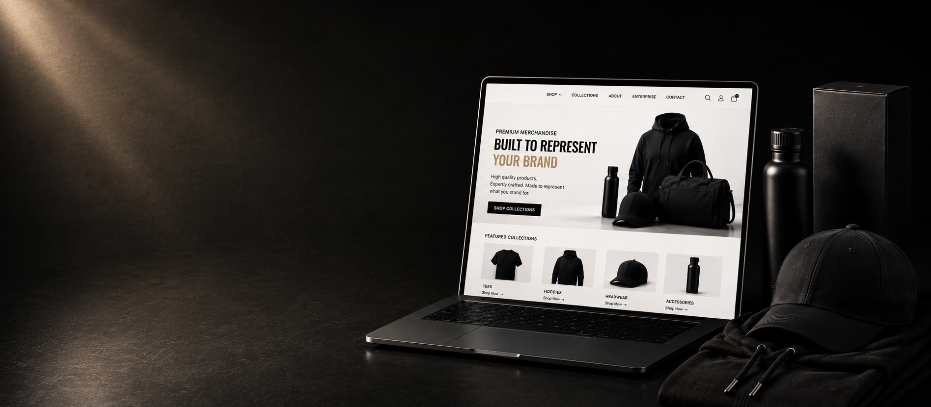 Laptop displaying the 4Winners Merch website next to custom branded apparel and drinkware products