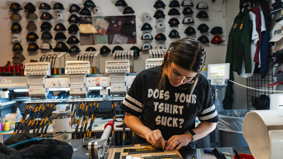 Embroidery wall and heat press finishing at 4Winners Merch