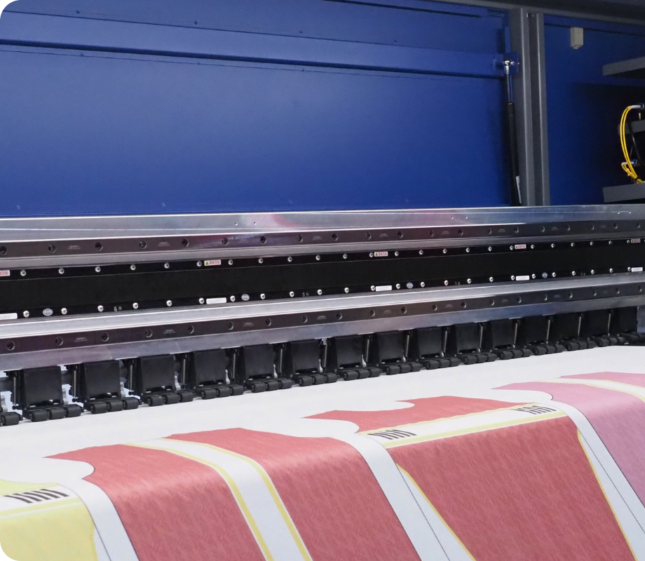 Large-format printing machine producing custom branded fabric at 4Winners Merch