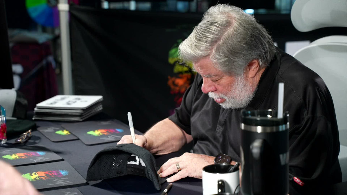 Steve Wozniak signing merchandise for fans